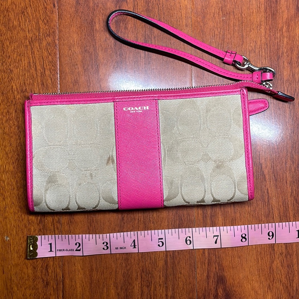 Coach pink and tan wristlet